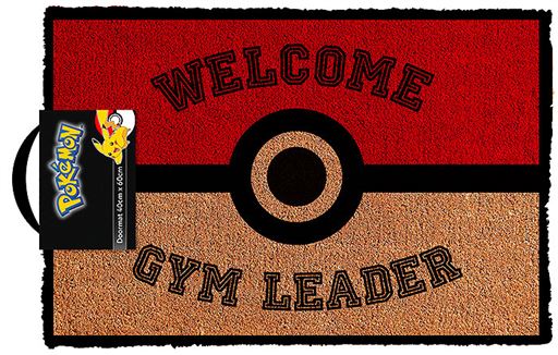 A doormat with an image of a Pokeball and text that says Pokemon - Welcome Gym Leader.